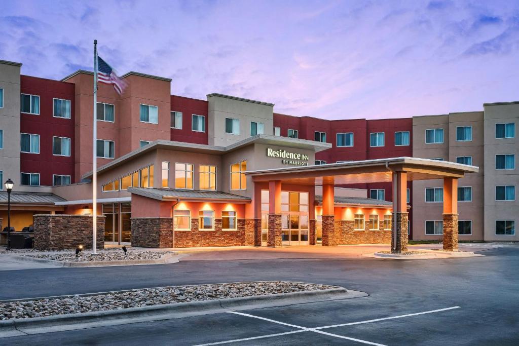 a hotel with a parking lot in front of it at Residence Inn by Marriott Rapid City in Rapid City