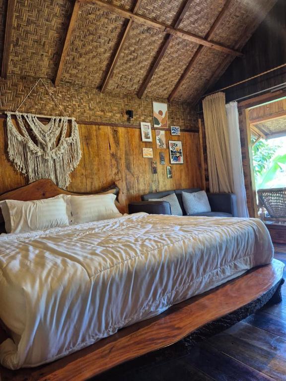 a bedroom with a large bed in a room at Lombok Rice Terracce Glamping in Tetebatu