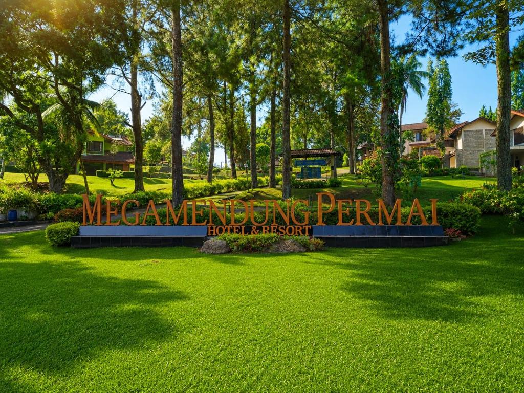 a sign for the meamling permanent sign in a park at Megamendung Hotel & Resort in Ciguntur