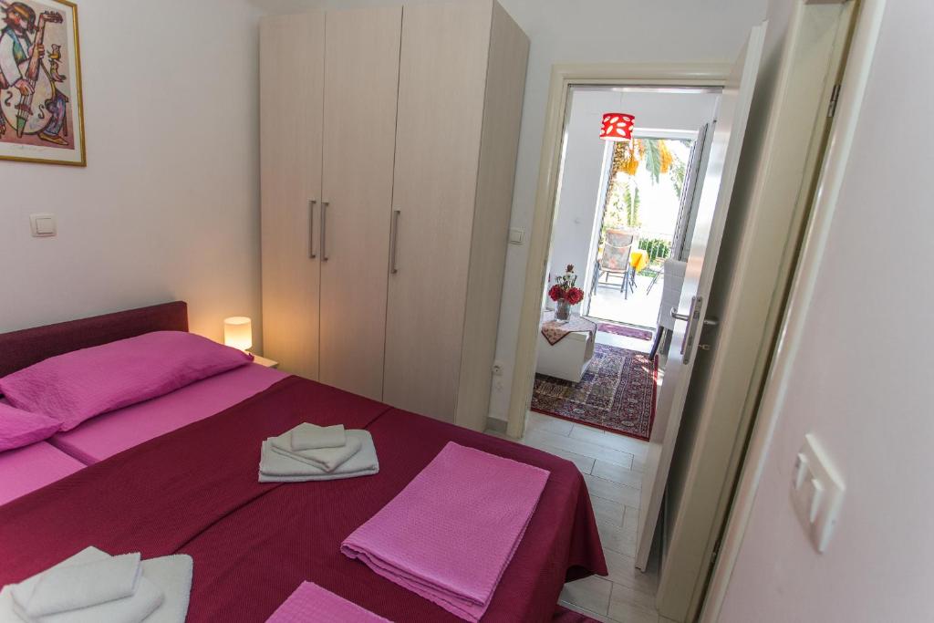 Posteľ alebo postele v izbe v ubytovaní Apartments Palma Ragusa