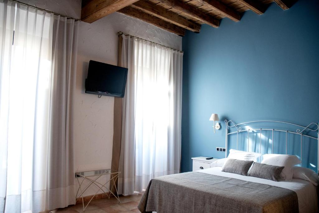 Postel nebo postele na pokoji v ubytování Sa Voga Hotel & Spa