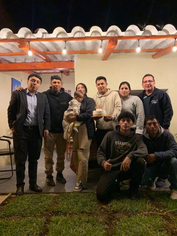 a group of people posing for a picture at Anta lodge in Huaraz