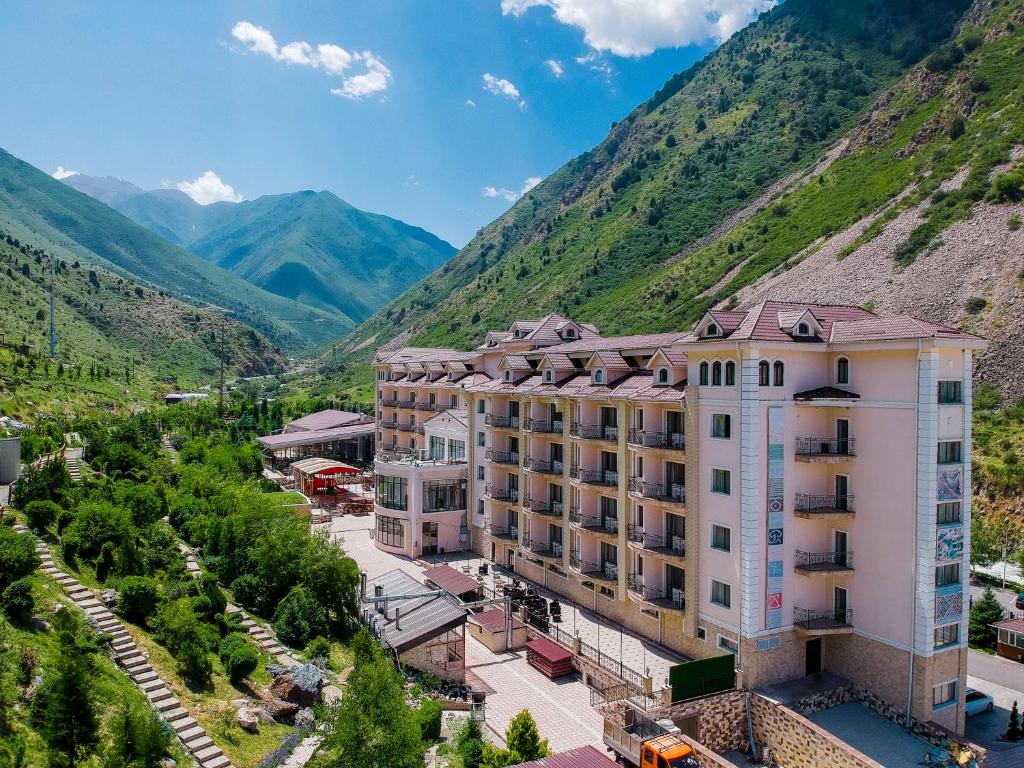 an aerial view of a hotel with mountains in the background at Jannat Resort in Alamedin