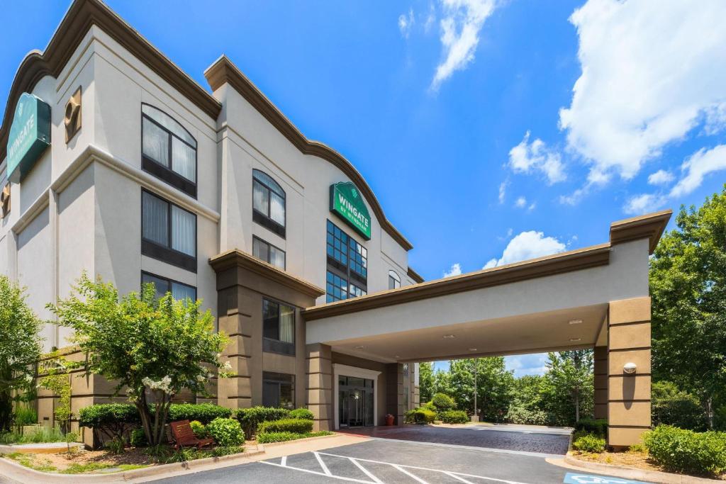 a rendering of a hotel building with a parking lot at Wingate by Wyndham Little Rock in Little Rock
