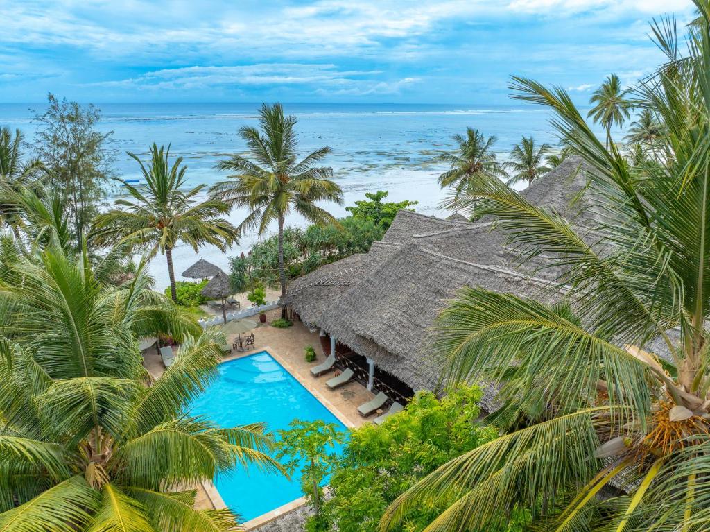 an aerial view of a resort with a swimming pool and the ocean at Zoi Retreat Hotel Zanzibar in Matemwe