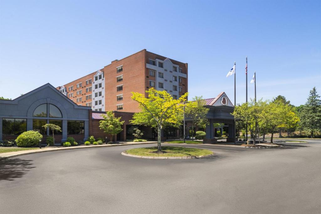 a building with a tree in the middle of a street at Doubletree by Hilton, Leominster in Leominster
