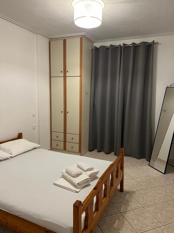 a bedroom with a bed with two towels on it at Platamon house in Platamonas