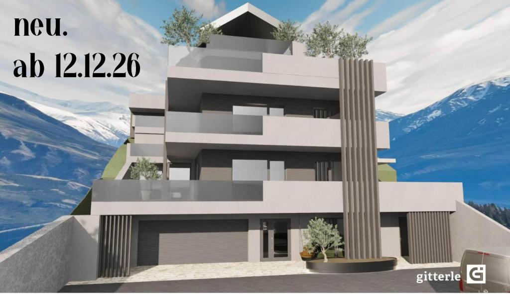 a rendering of a building with mountains in the background at Augusta Apartments in Fliess
