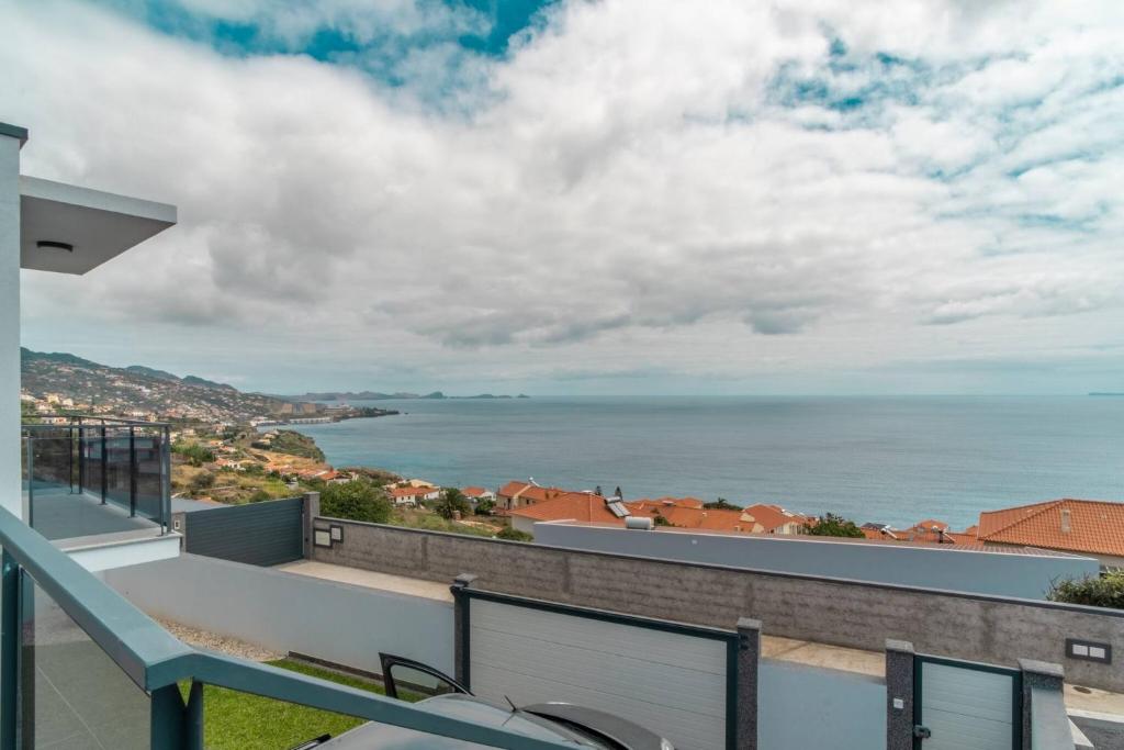 a balcony with a view of the ocean at Isaq Villa in Santa Cruz in Gaula