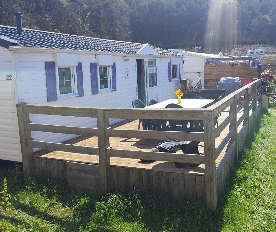 a wooden deck in front of a tiny house at San gavino in Savines