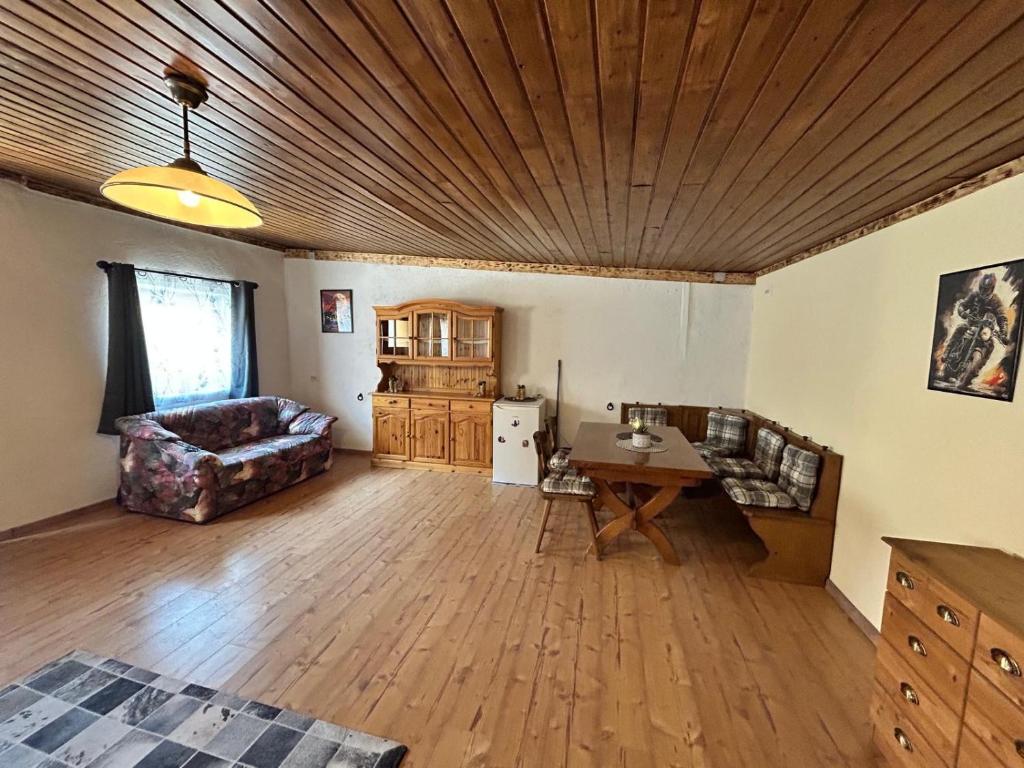 a large living room with a table and a couch at Zum Alten Pferdestall in Eppingen
