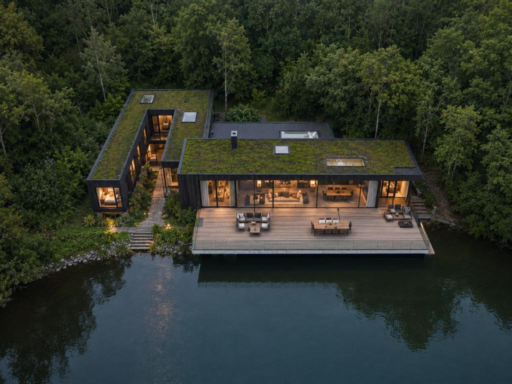 an aerial view of a house with a green roof at De Holiday Home in Haenertsburg