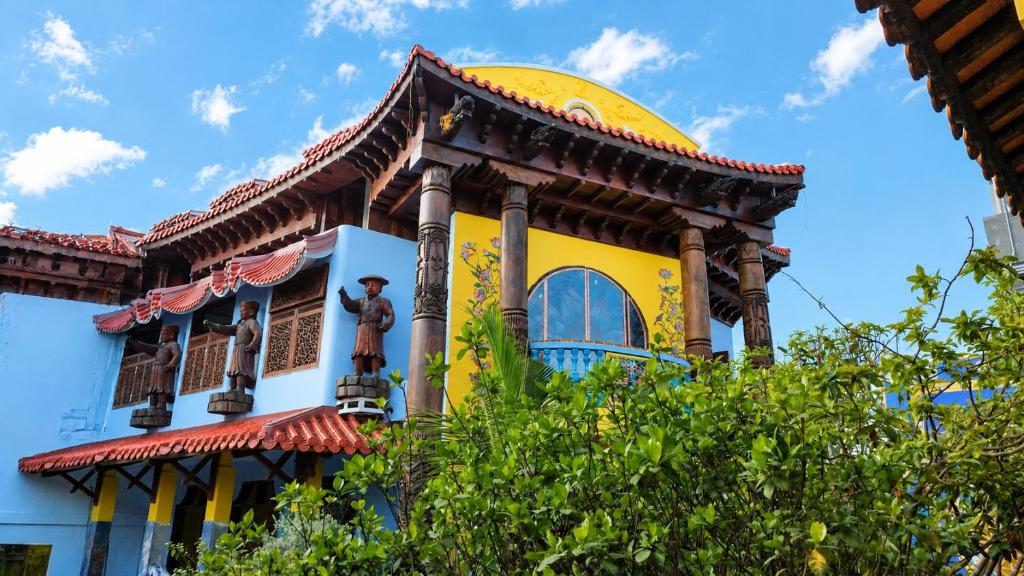 a building with a statue on top of it at Thien Y Villas in Hue