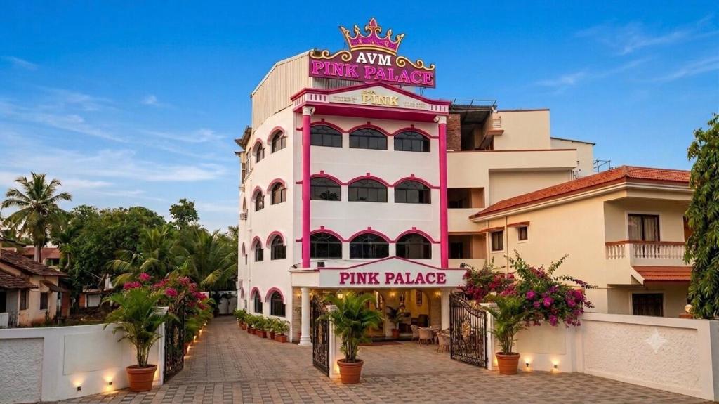 a pink building with a pink palace sign on it at Hotel Pink Palace - Triplicane, Chennai in Chennai