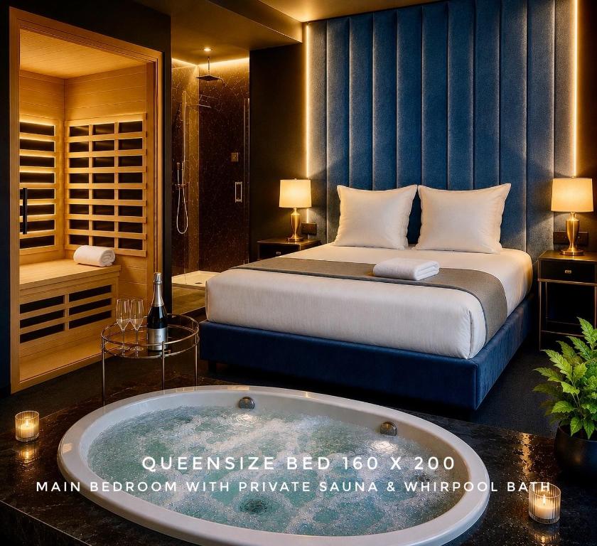 a bedroom with a bed and a bath tub at Life VOYAGE Résidence & Spa by Life Renaissance - Place KLEBER in Strasbourg