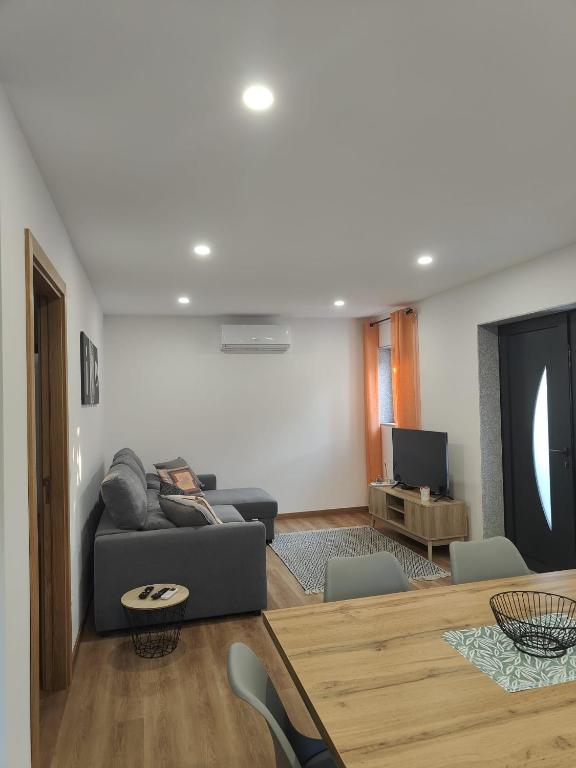 a living room with a couch and a table at Gondar Stays T2 