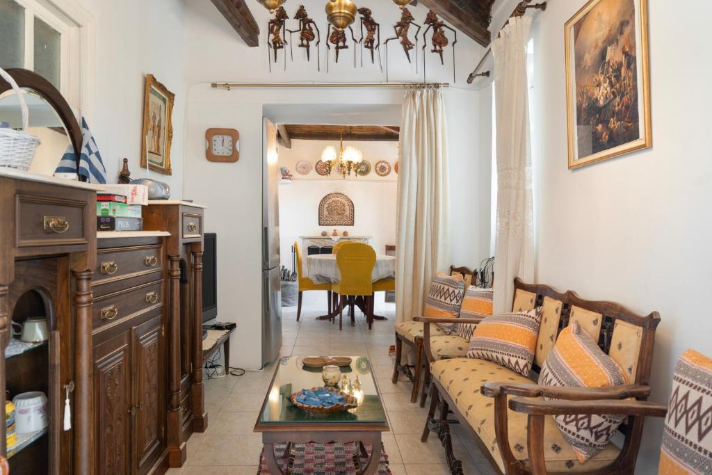 a living room with a couch and a table at Giannis Mountain House in Aigio