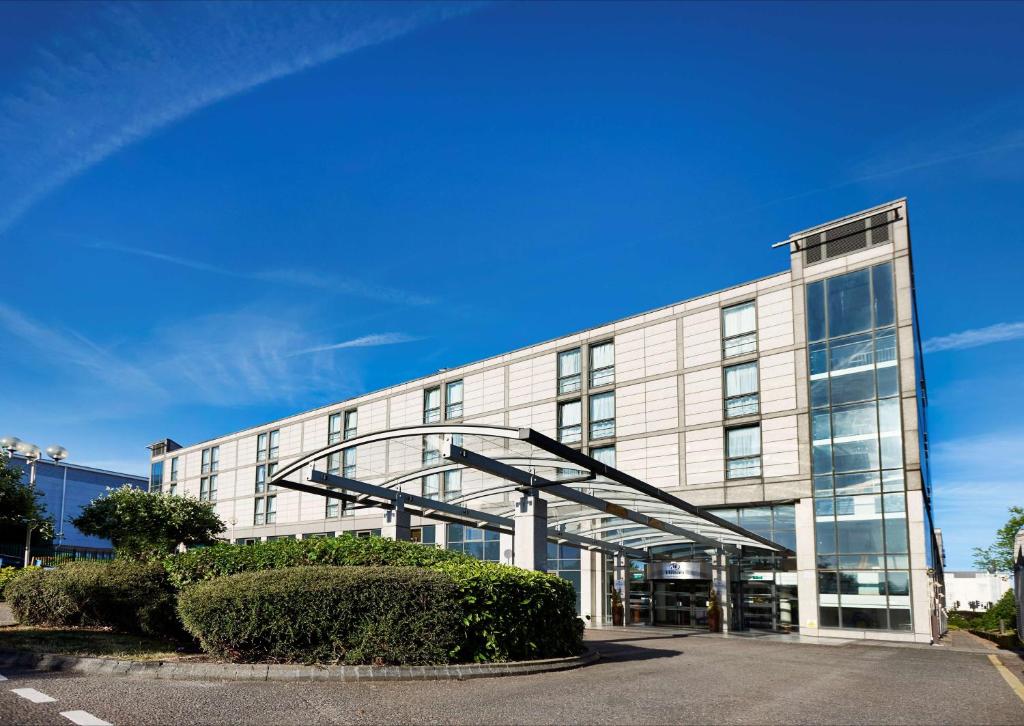 a large office building with a glass facade at Hilton London Croydon in Croydon