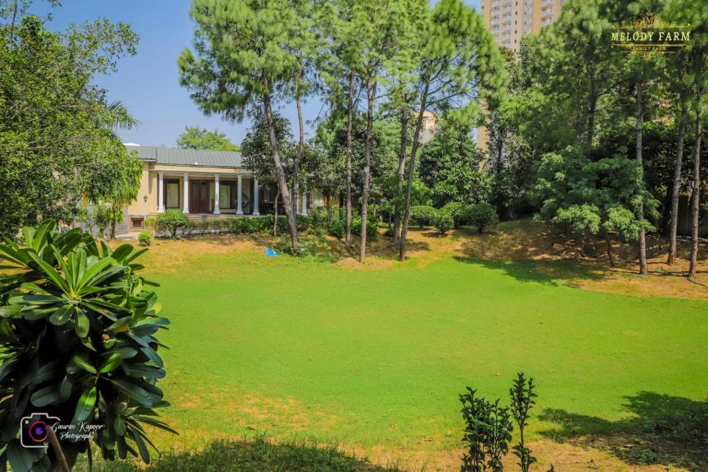 an image of a yard with a house at The Mint Resort in Gurgaon