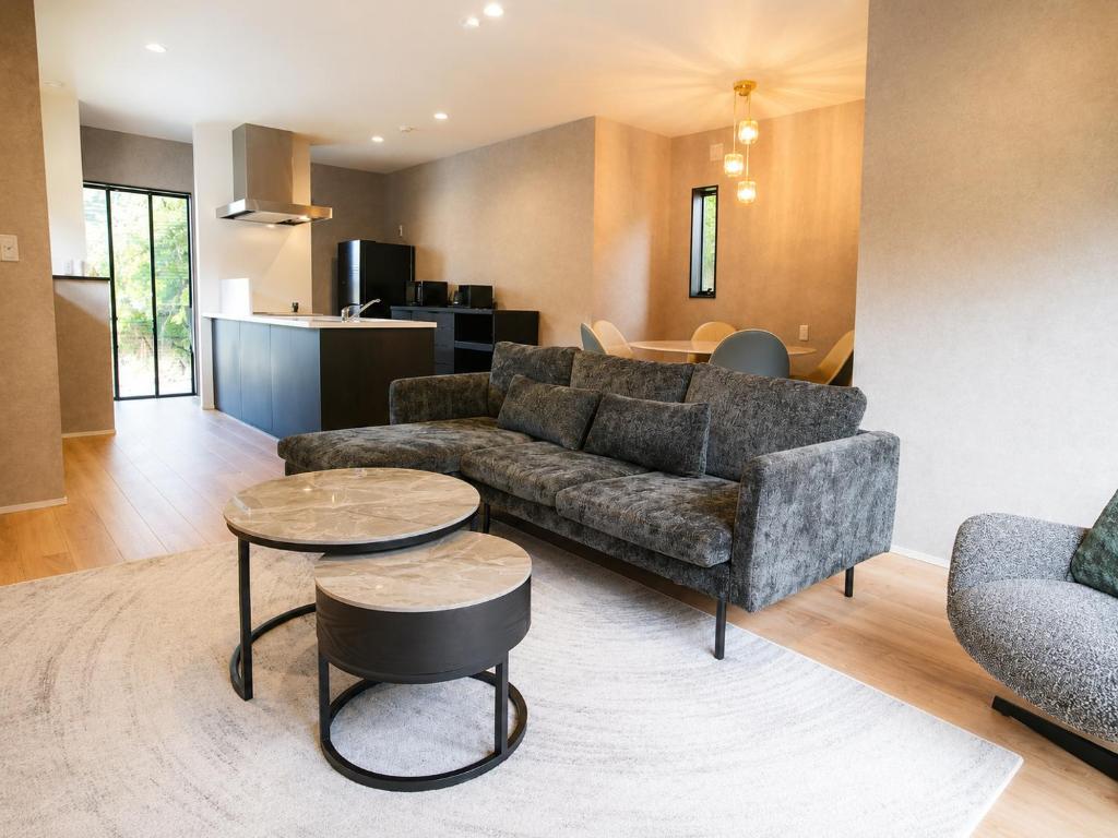 a living room with a couch and a table at Awaji Play Resort in Minamiawaji