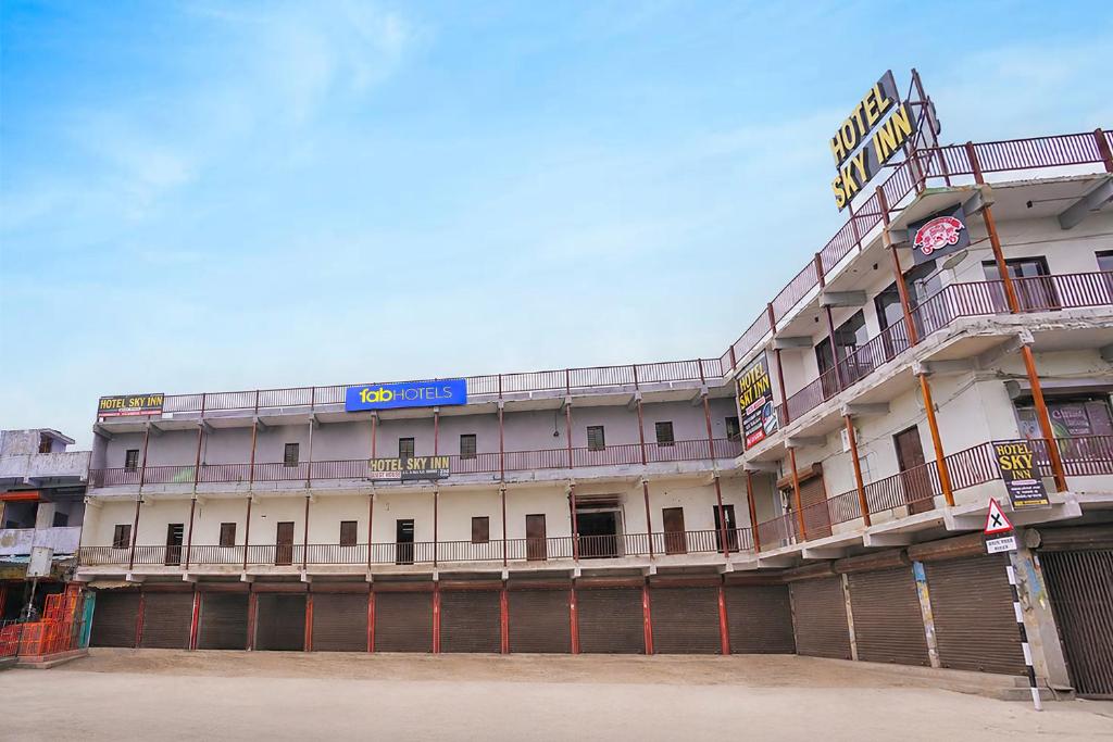 a building with a sign on the side of it at FabHotel Sky Inn I in Ahmedabad