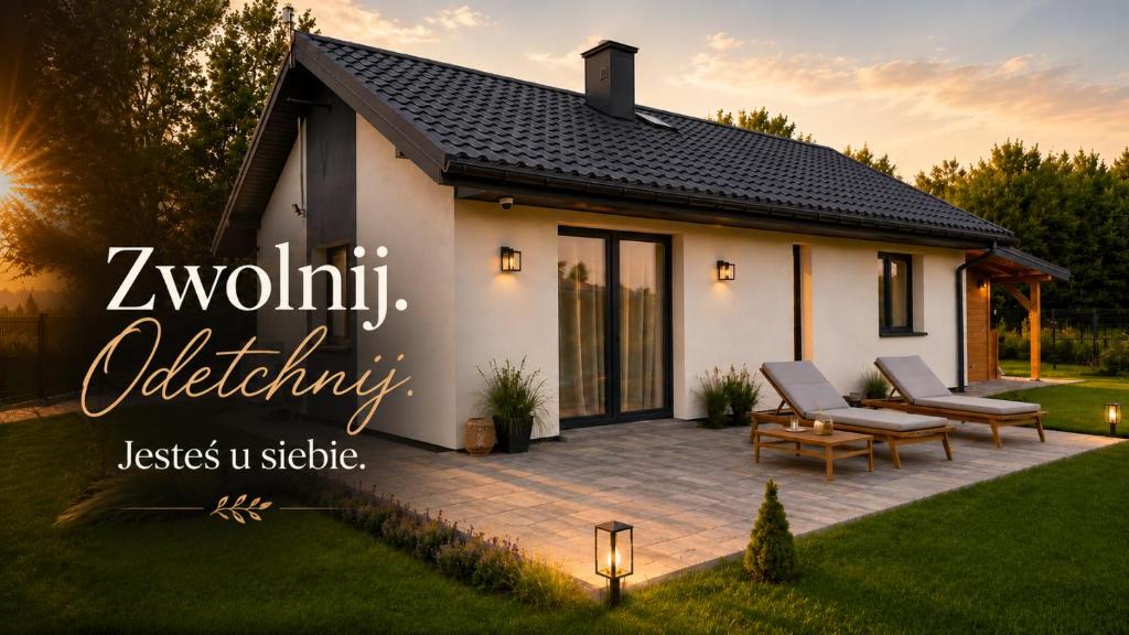 a house with a patio in a yard at Luna Lake - Twój azyl nad Jeziorem Białym in Gostynin