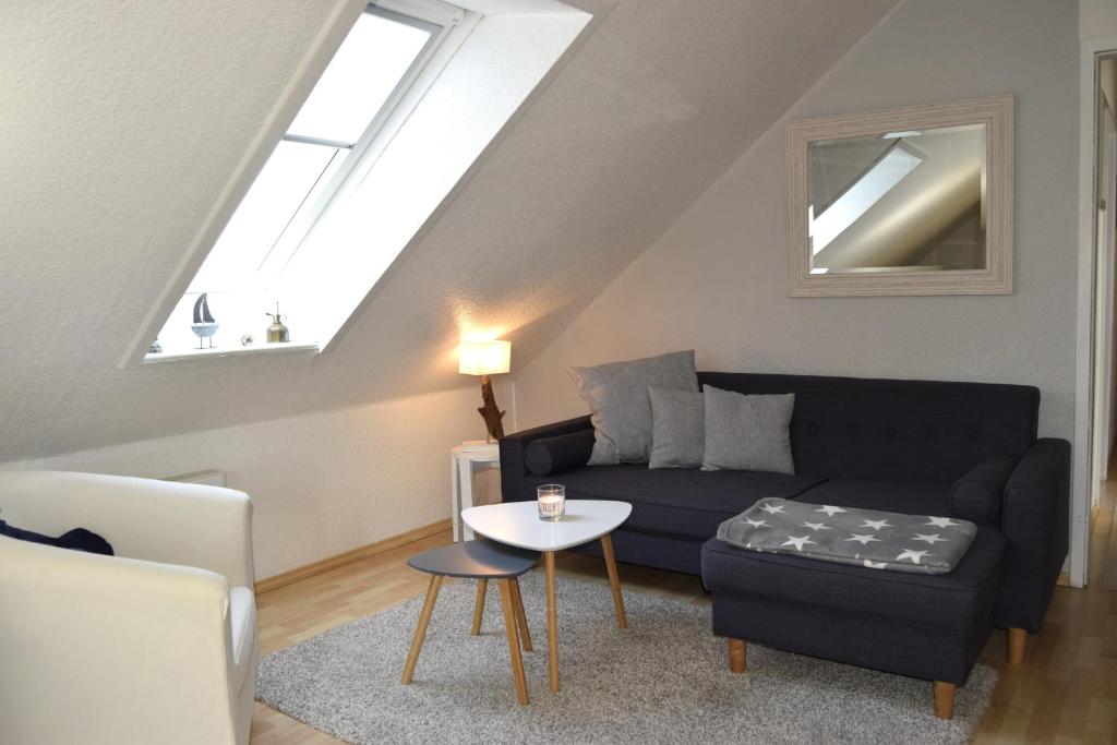 a living room with a couch and a table at Wichmann, Ursula & Axel in Schönberg