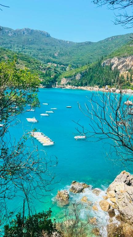 a view of a lake with boats in the water at Villa Maria 1 in Paleokastritsa