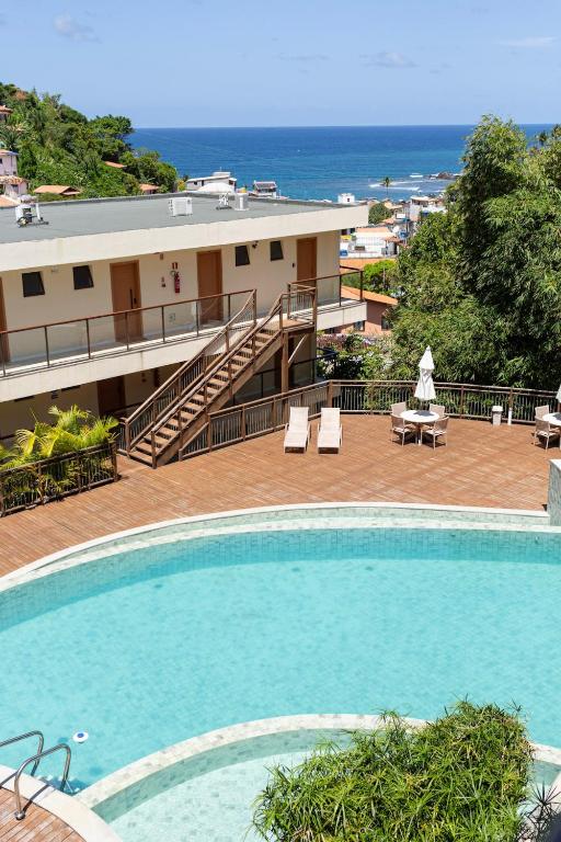 a large swimming pool in front of a building at Casa BACO - Morro de São Paulo in Cairu