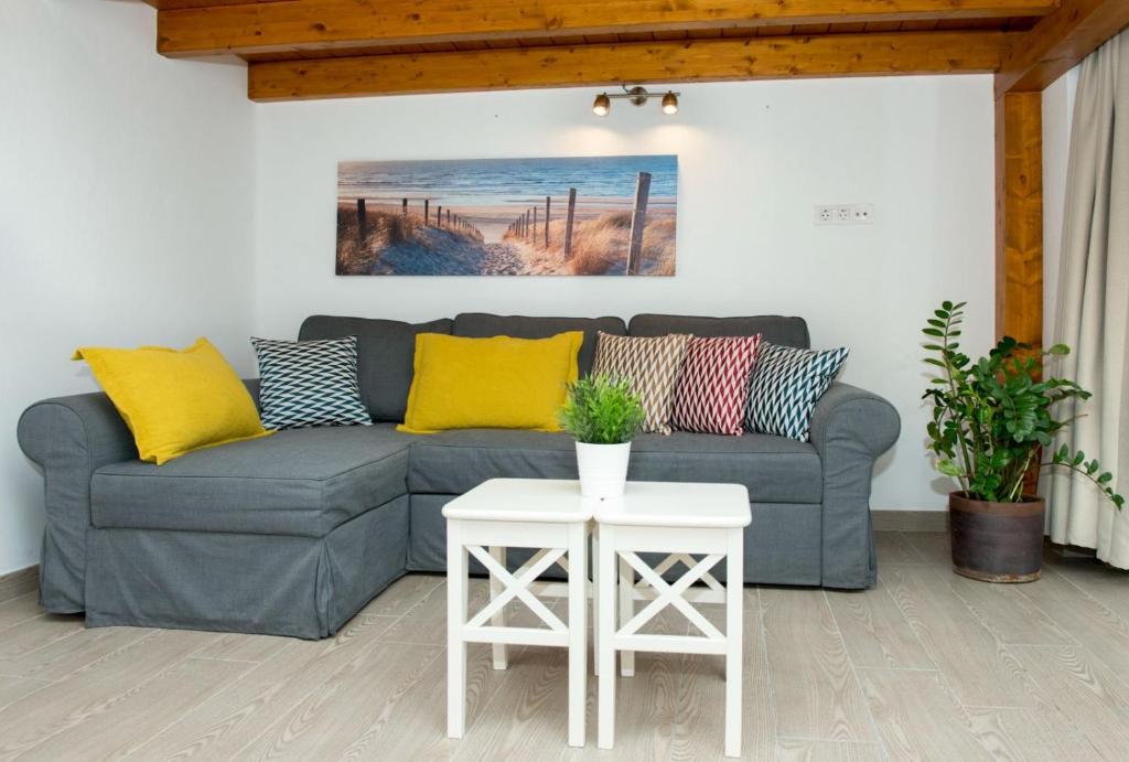 a living room with a couch and a table at Famara Marea 2 in Famara