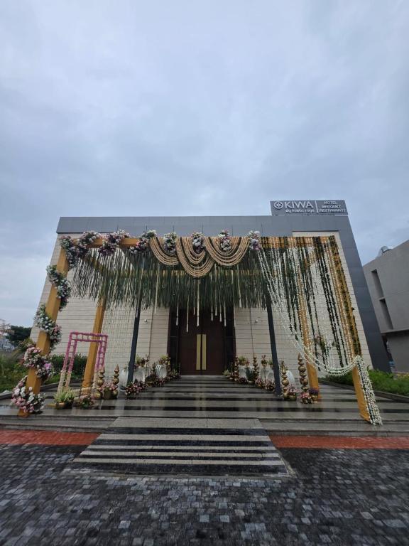 a building with a stage in front of it at Kiwa Banquet & Hotel in Koba