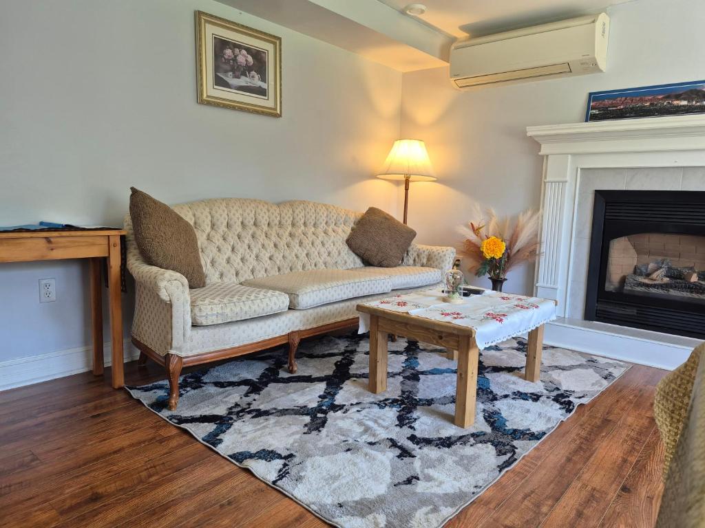 a living room with a couch and a coffee table at Comfortable stay - 2-bedroom apartment in Saint John