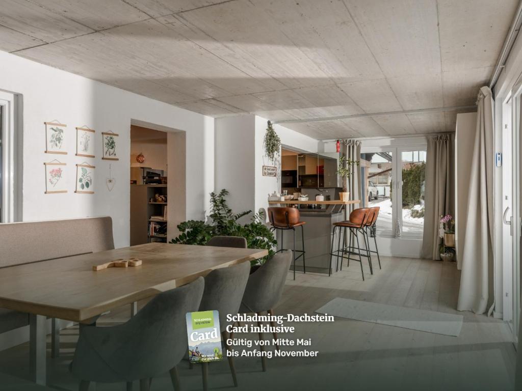 a dining room and kitchen with a table and chairs at QUARTIER 179 by Schladming-Appartements in Schladming