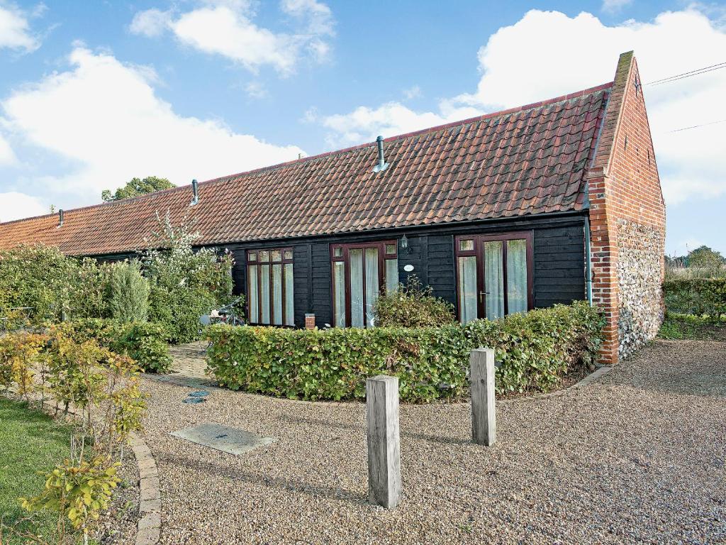a brick house with a brown roof at Rosemary - E4484A in Catfield