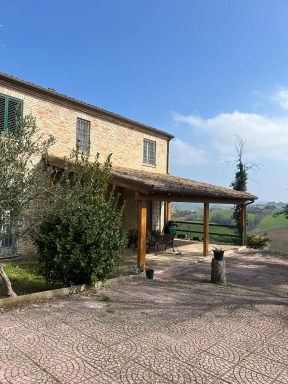 a large building with a pavilion in front of it at A casa di Leyla in Monteluro