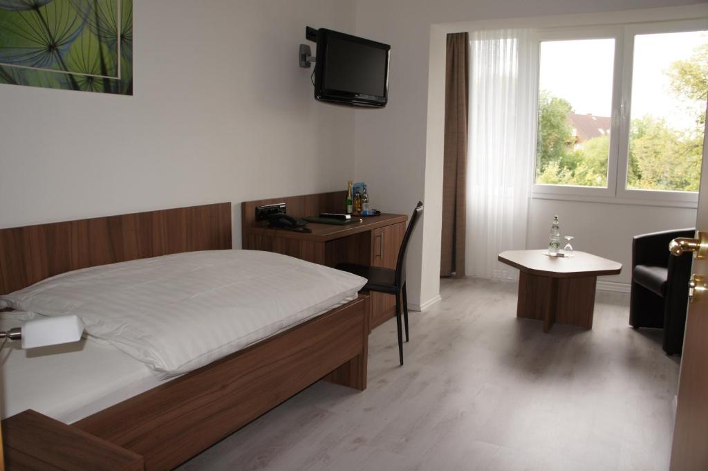 Postel nebo postele na pokoji v ubytování Hotel Muschinsky