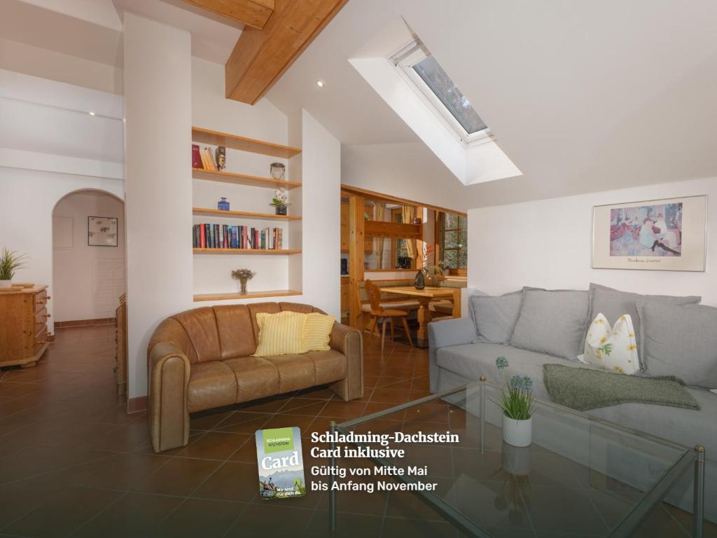 a living room with a couch and a table at Appartement Berggasse by Schladming-Appartements in Schladming