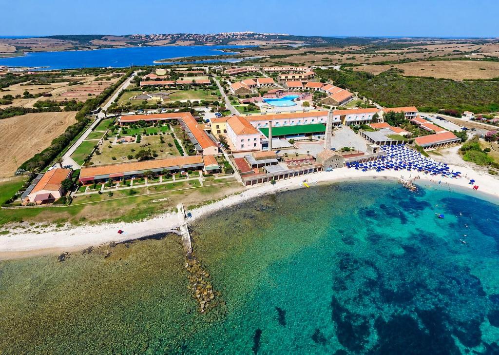 an aerial view of a resort on the beach at La Tonnara House in Stintino