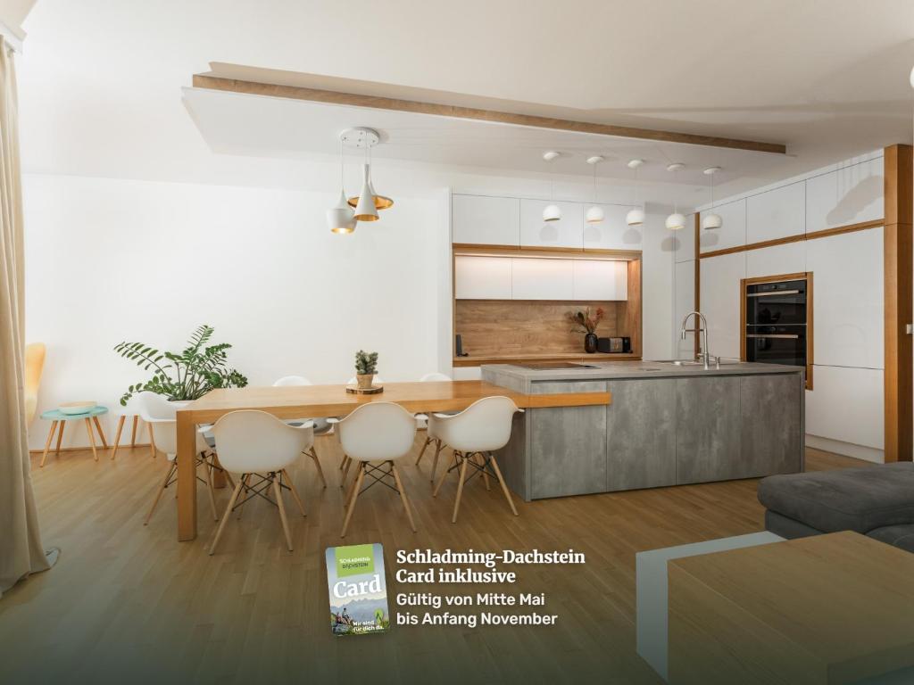 a rendering of a kitchen and living room at Stadtdomizil Schladming by Schladming-Appartements in Schladming