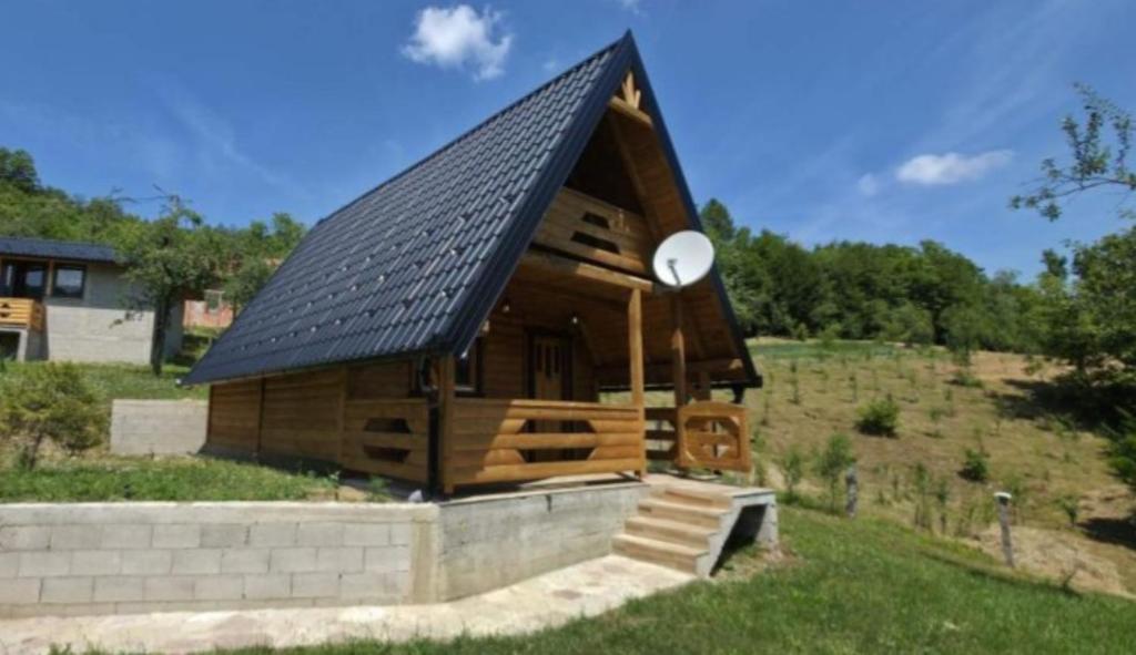 a large wooden cabin with a pitched roof at Vlado Retreat in Banja Luka