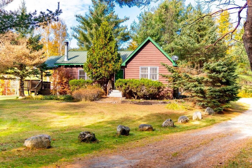 a house with a gravel road in front of it at Mountain Home, Views, Near Whiteface, Lake Placid in Wilmington