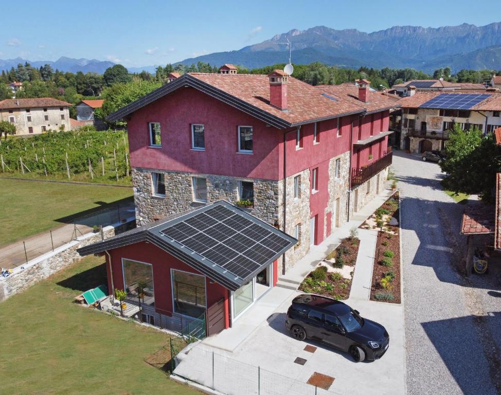 an aerial view of a house with solar panels on it at Alla Corte del Gallo in Tricesimo