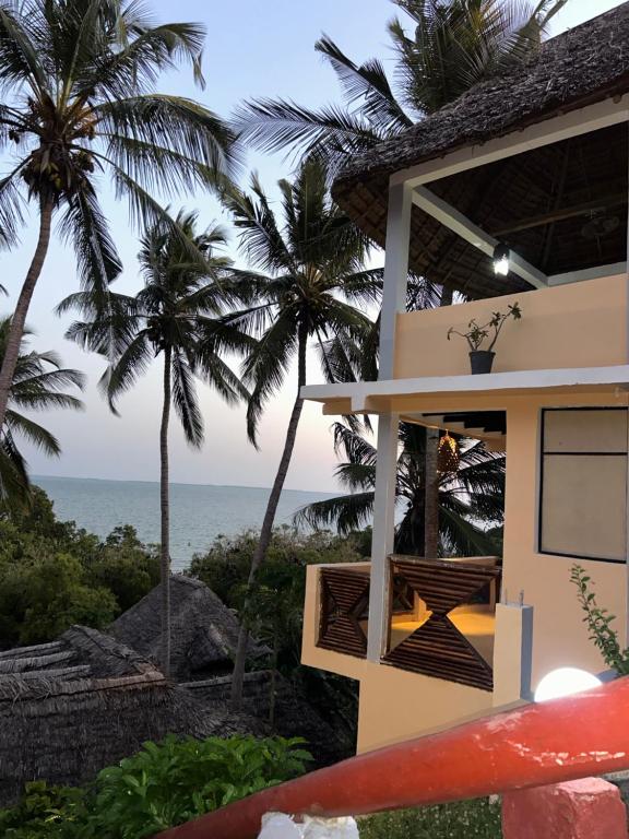 a house with a view of the ocean at Mafia Beach Bungalows sea view in Utende