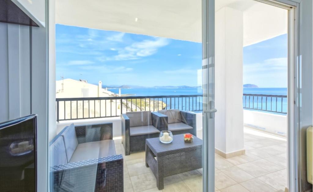 a balcony with a couch and a coffee table at Son Baulo in Can Picafort