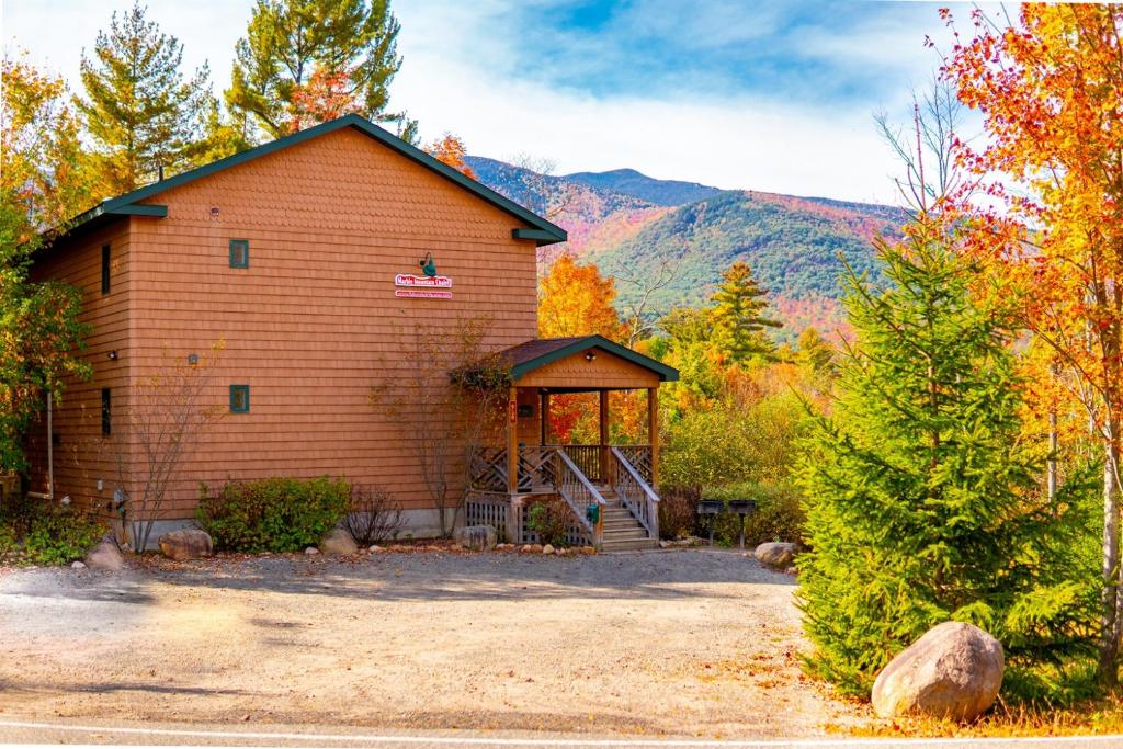 a building with a gazebo in the woods at Beautiful Home, Views, Near Whiteface, Lake Placid in Wilmington