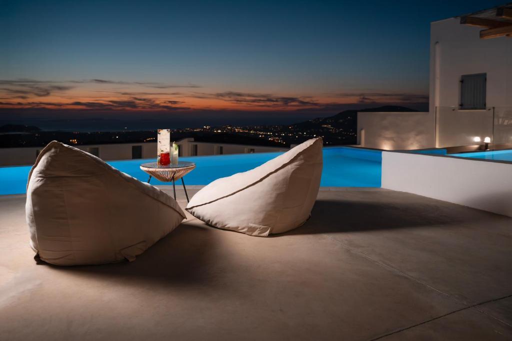a pair of pillows sitting on top of a roof at Mandilaras Village - The Panorama of Naxos in Vívlos