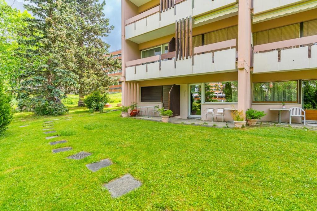 an empty yard in front of a building at Studio Mayen with terrace and mountain views in Leukerbad