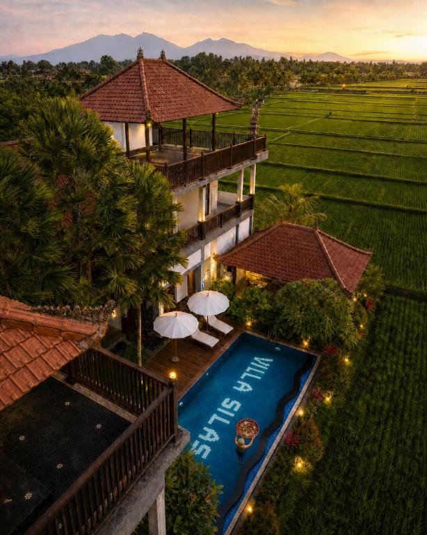an aerial view of a resort with a swimming pool at Villa Silas Ubud Bali in Ubud