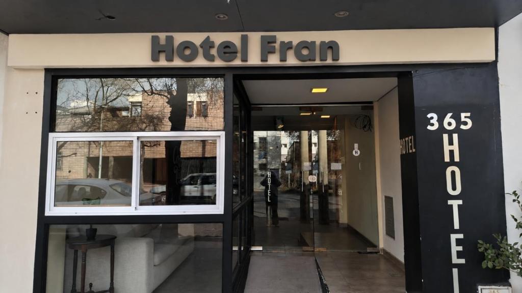 a hotel entrance with the entrance to a building at Fran hotel boutique in Mendoza
