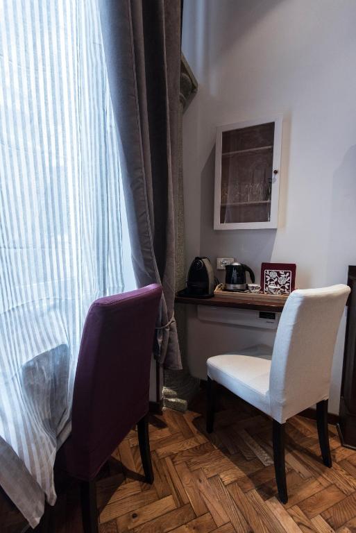 Televízia a/alebo spoločenská miestnosť v ubytovaní Vite Suites Guest House